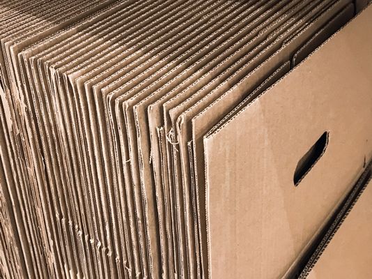 boxes-moving-corrugated-cardboard-with-handles-carrying-stacked-stand-stand
